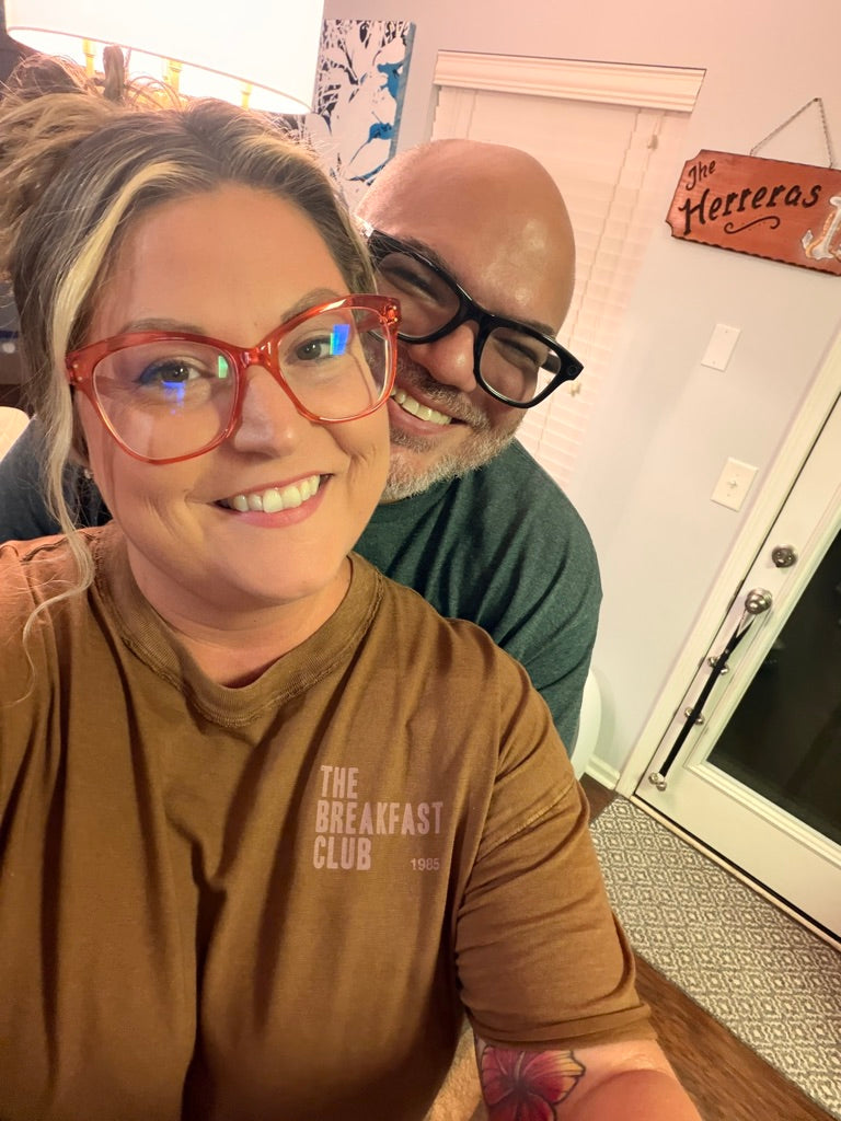 Vince and Hollie Herrera, founders of Cuban Cracker Family Kitchen, smiling together in a candid photo at their home in Hendersonville, Tennessee.
