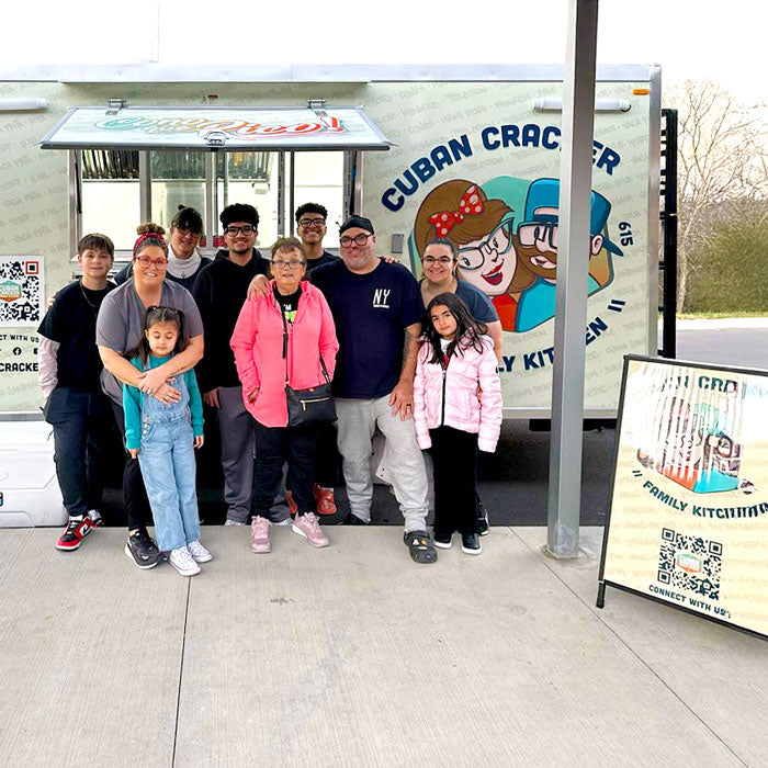 Cuban Cracker Family Kitchen family and team standing in front of the food truck in Hendersonville, Tennessee